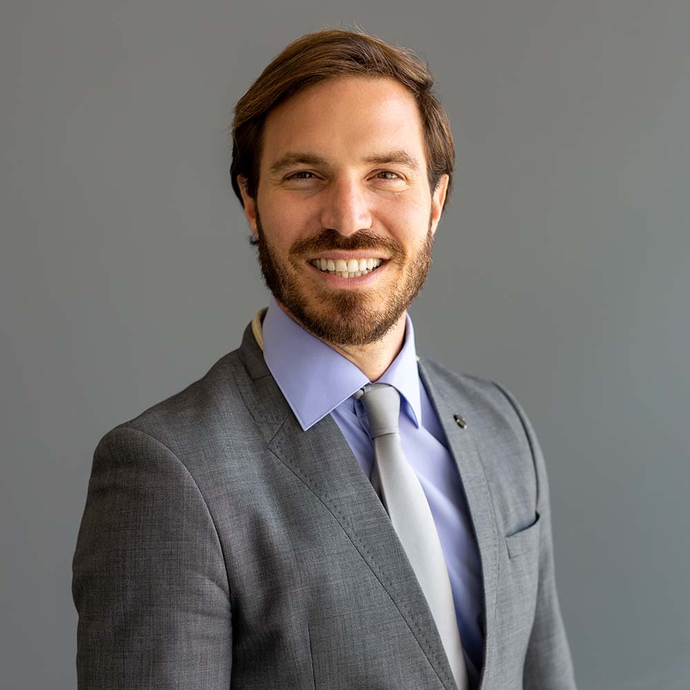 handsome-smiling-confident-businessman-portrait-in-2YV6JUA.jpg